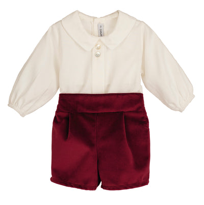 White blouse with long sleeves and maroon shorts on a white background