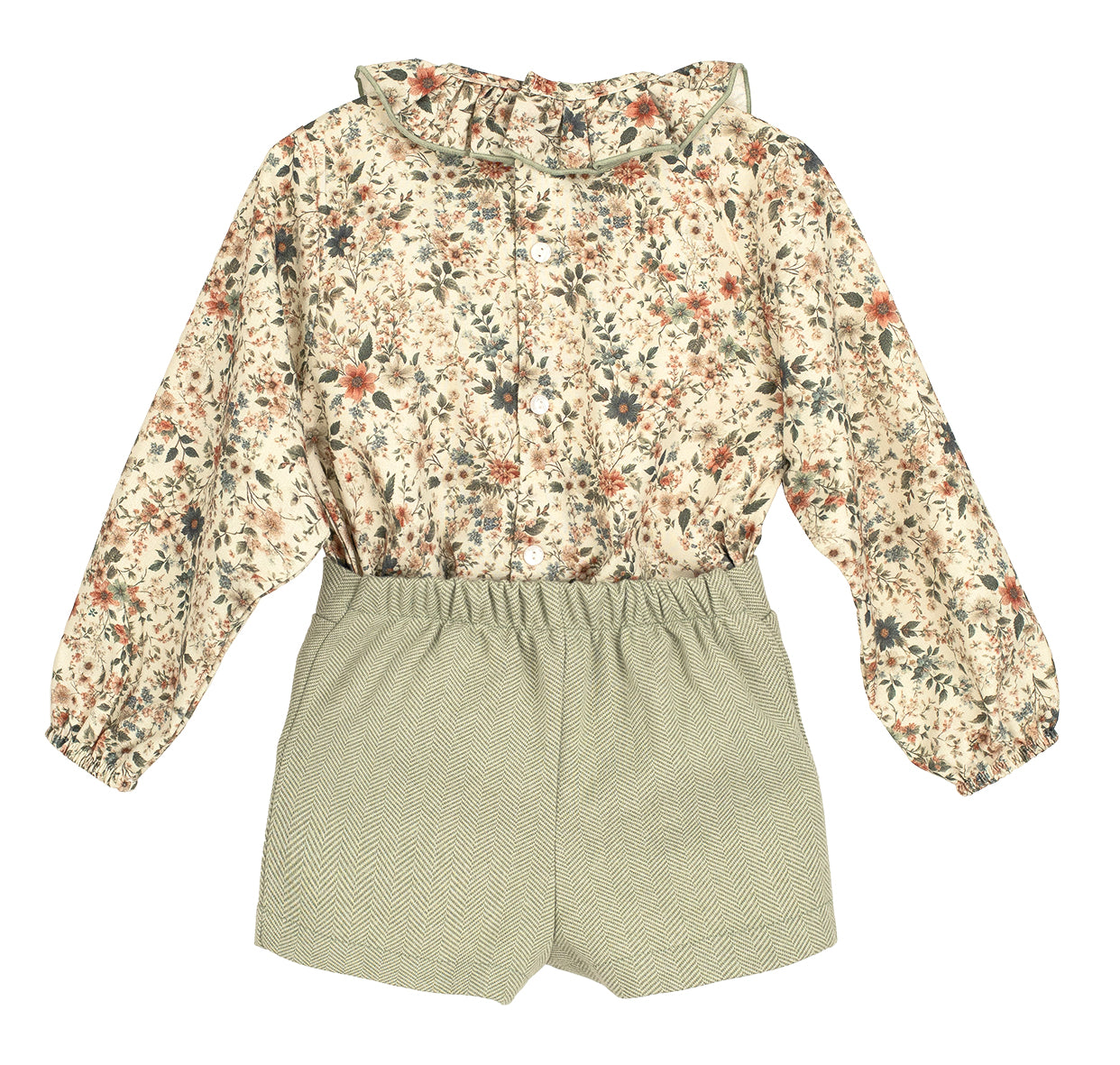 Floral blouse and green shorts set on a white background