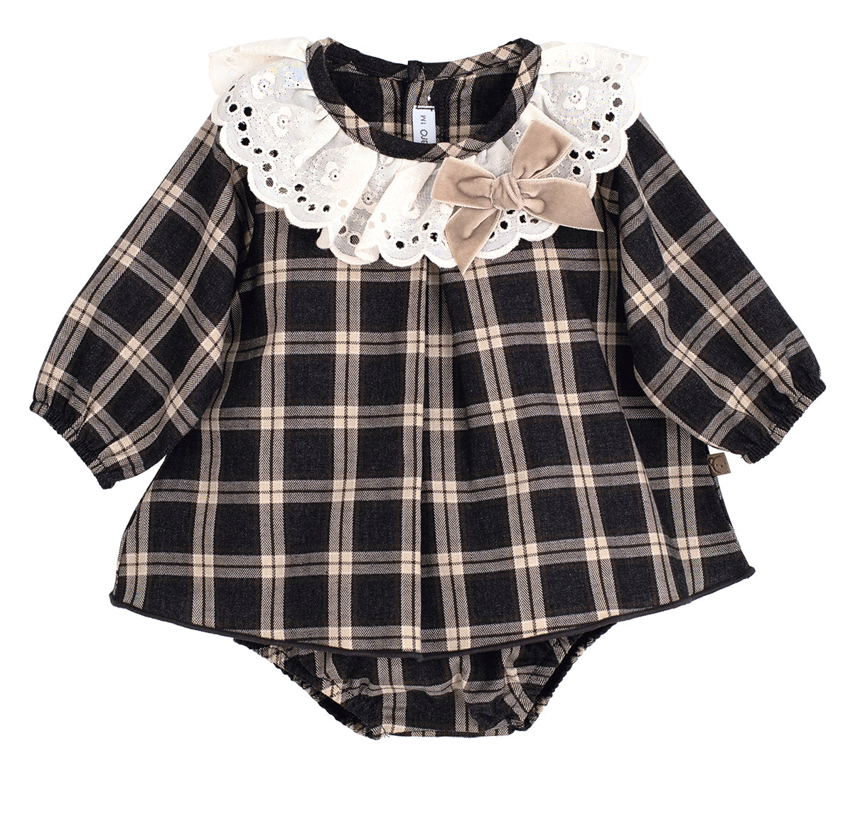Black and beige plaid baby outfit with lace collar and bow on a white background