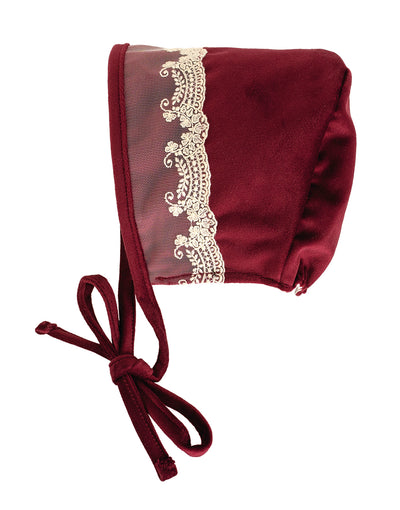 Maroon baby bonnet with lace trim on a white background